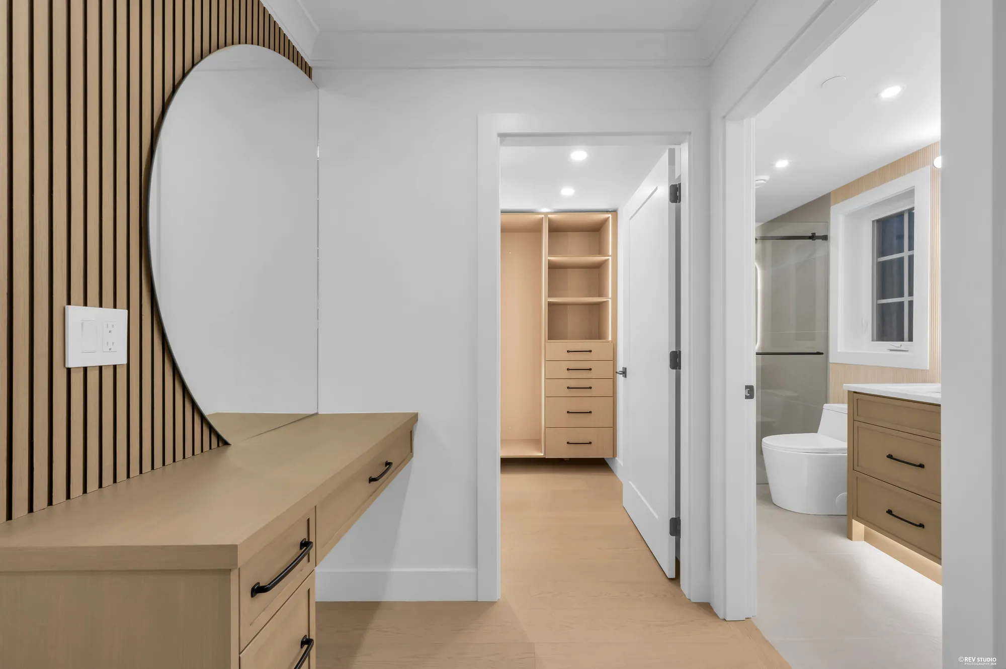 Hall with a curved fluted panel and a walk-in beyond