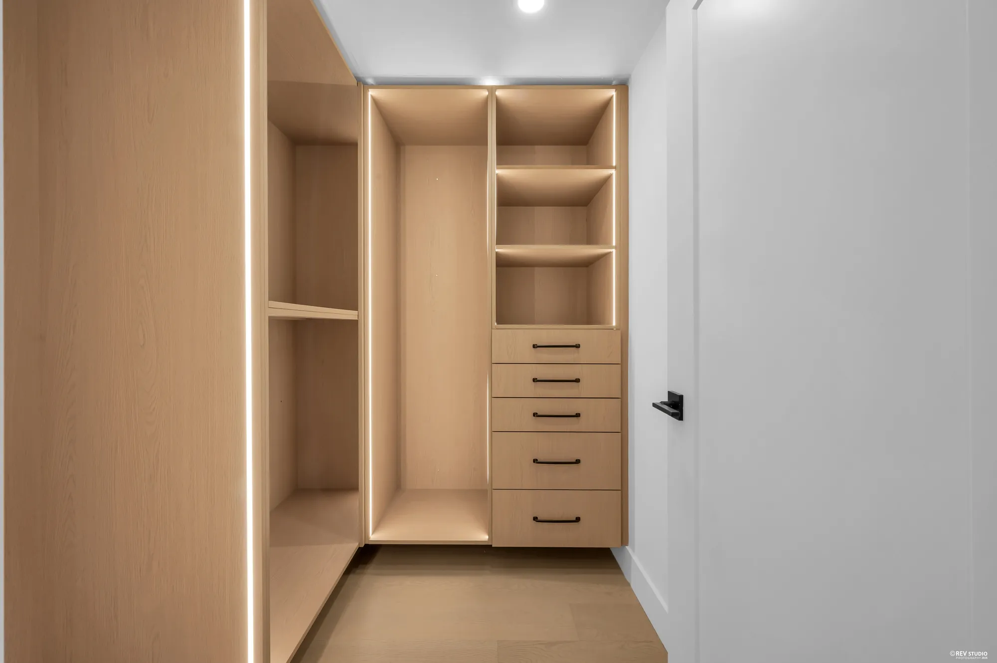 Walk-in closet fitted with shelves and drawers